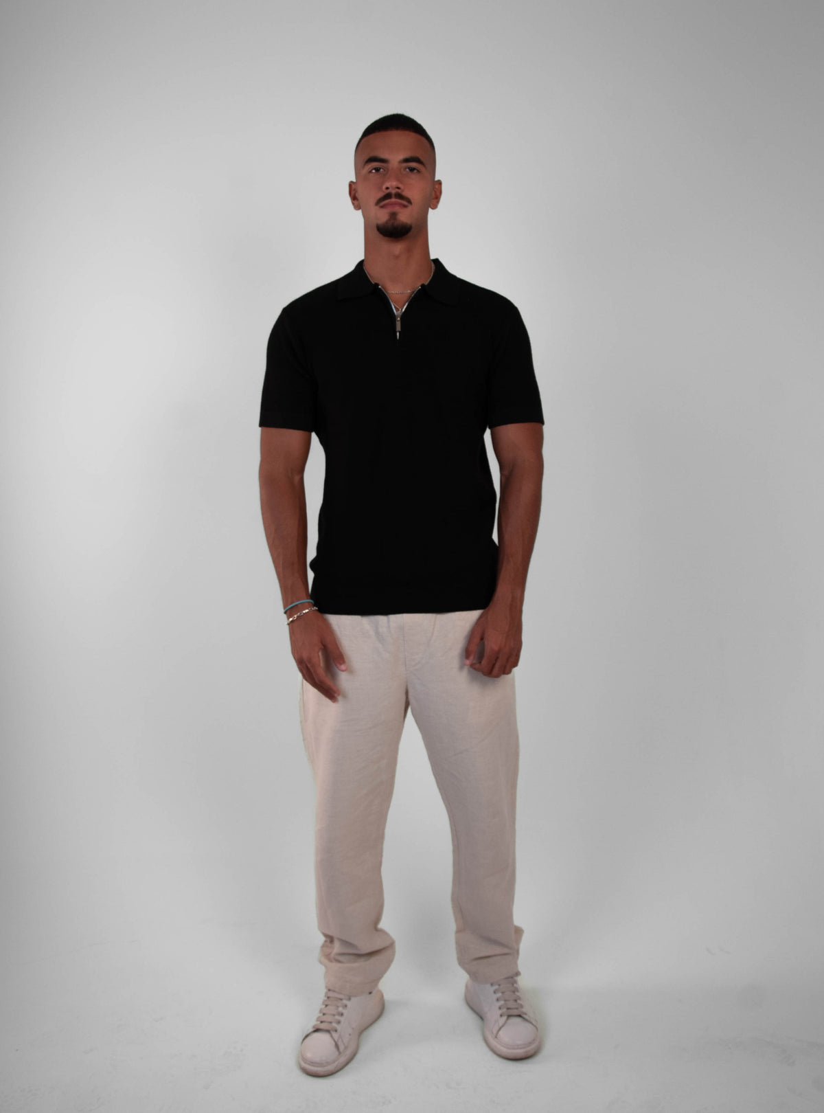 BLACK KNIT ZIP-UP POLO