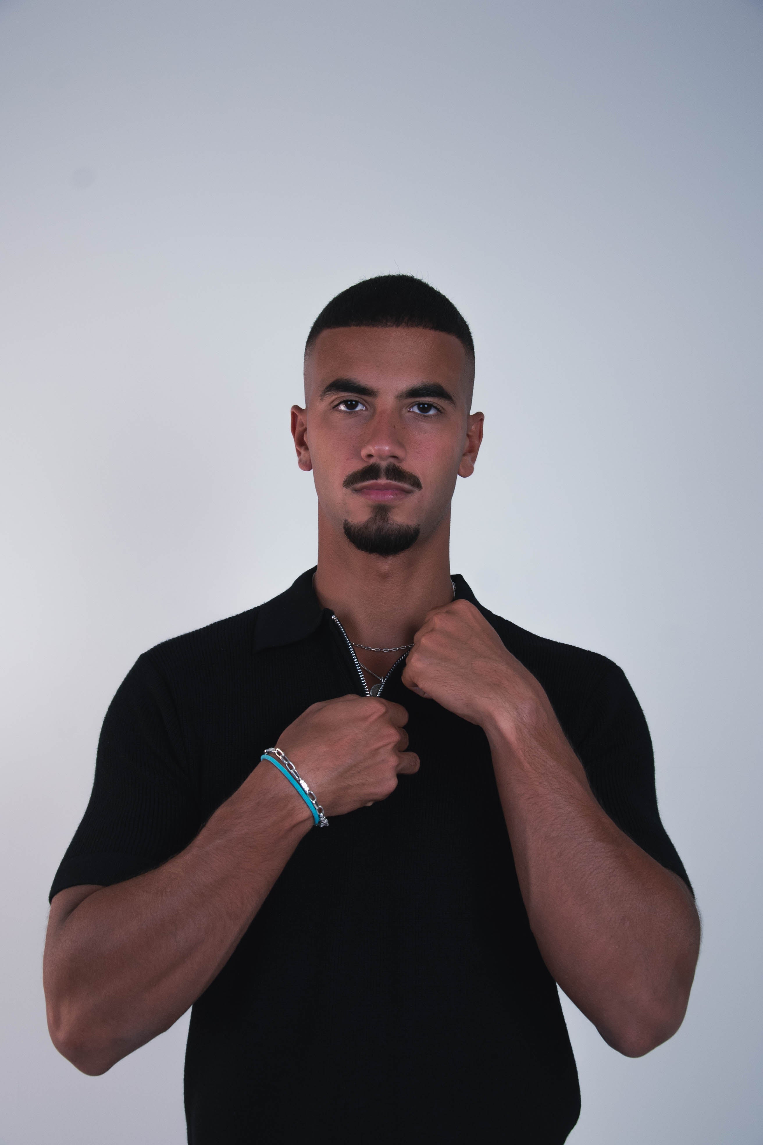 BLACK KNIT ZIP-UP POLO